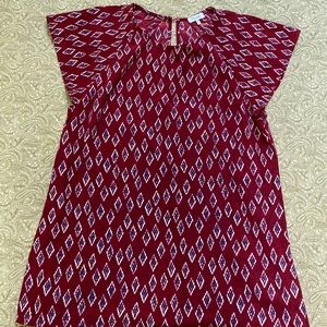 Red patterned blouse